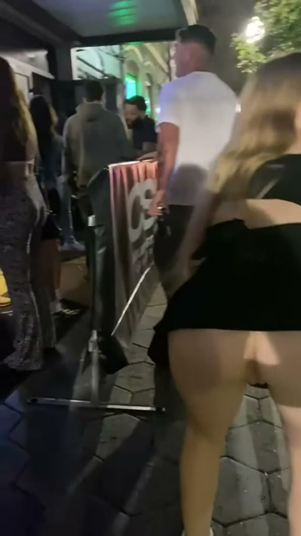 Flashing her butthole in the middle of the crowd