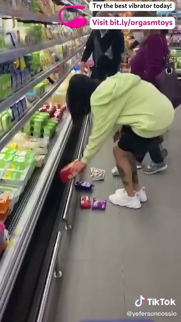 Controlling her vibrator at the shop